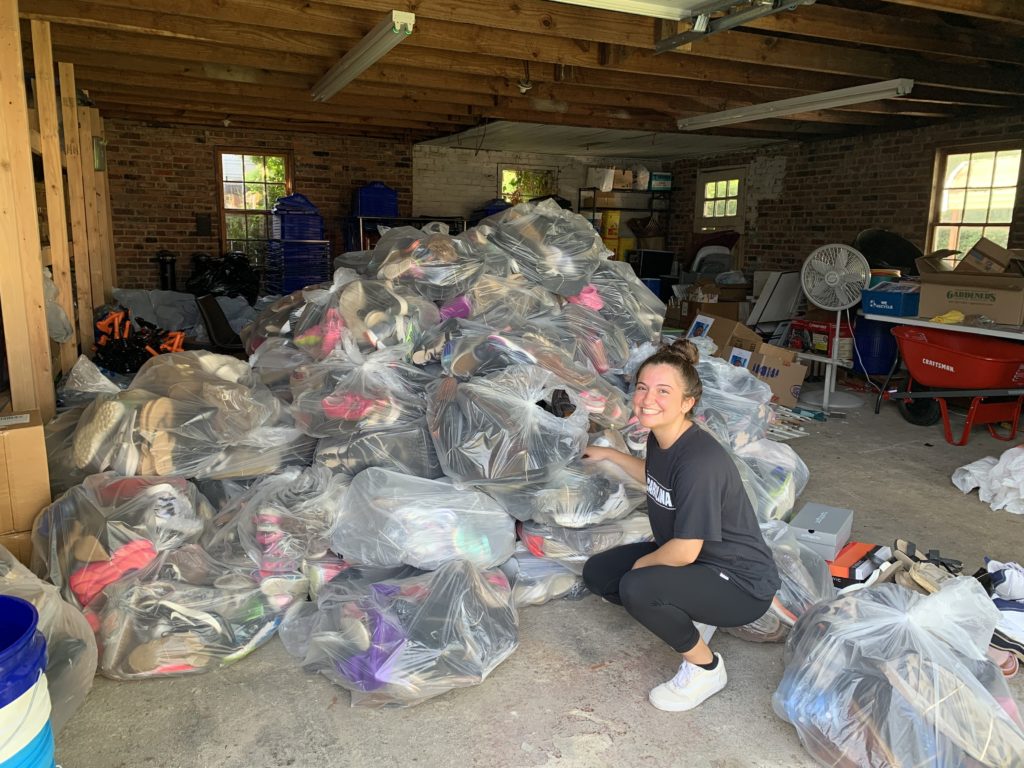Shoes-Tina with Pile of 127 Bags-July 2021
